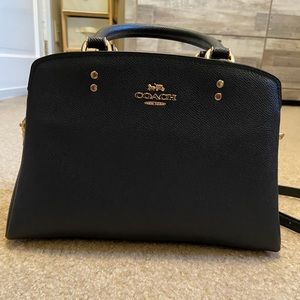 Coach crossbody with handles.